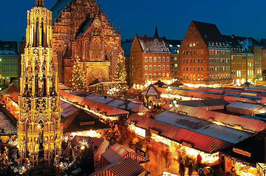 Nuremberg Christkindlesmarkt at dusk with the Beautiful Fountain, a highlight of Christmas market river cruises Europe travelers love